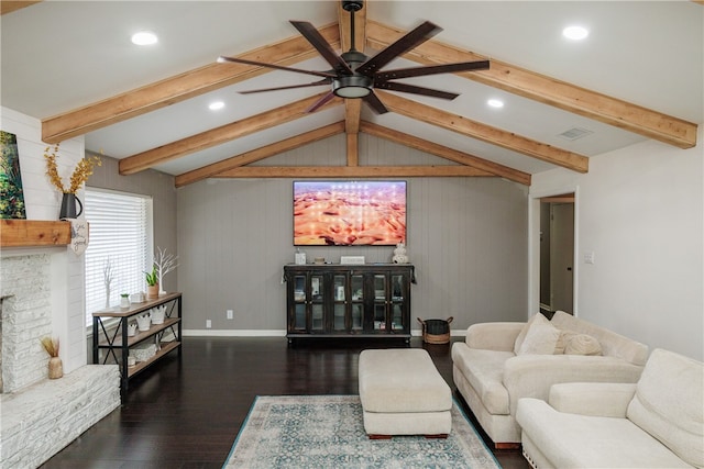 living room featuring dark hardwood / wood-style flooring, a brick fireplace, ceiling fan, lofted ceiling with beams, and wood walls