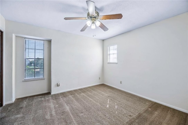 carpeted empty room with ceiling fan