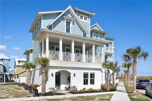 view of front of house featuring a balcony and a garage