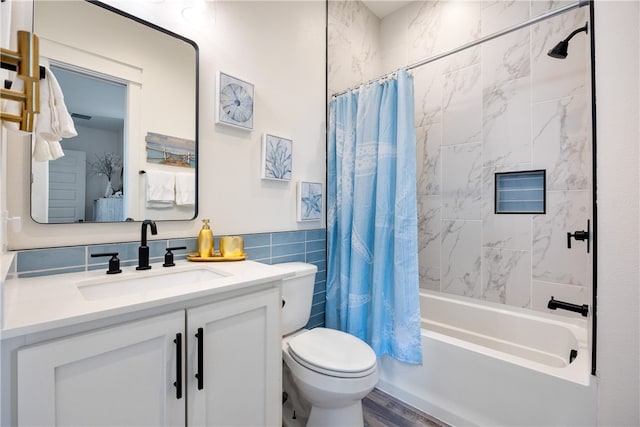 full bathroom with vanity, hardwood / wood-style flooring, toilet, tile walls, and shower / tub combo with curtain