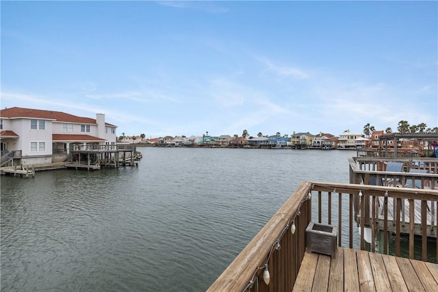 dock area with a water view