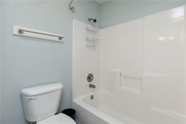 bathroom with toilet and shower / washtub combination