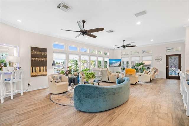 2110 Harbor Ct, Rockport, TX 78382 - living area featuring a ceiling fan, light wood-type flooring, crown molding, recessed lighting, and baseboards
