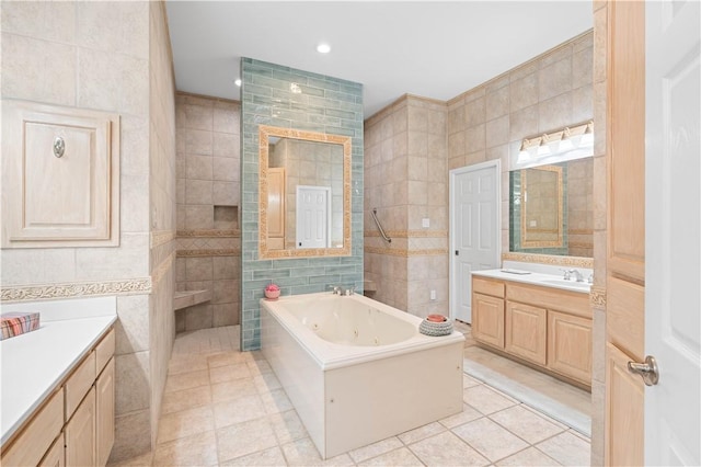 2110 Harbor Ct, Rockport, TX 78382 - full bath featuring tile walls, tile patterned floors, vanity, a jetted tub, and a walk in shower