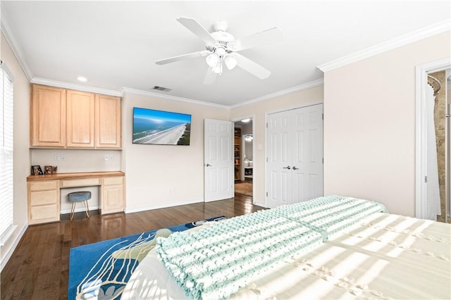 2110 Harbor Ct, Rockport, TX 78382 - bedroom with ornamental molding, dark wood-type flooring, baseboards, ceiling fan, and a closet