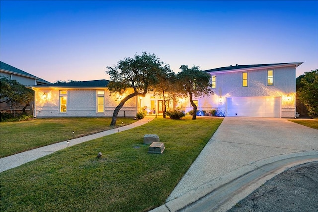2110 Harbor Ct, Rockport, TX 78382 - view of front facade with driveway, a front yard, a garage, and stucco siding