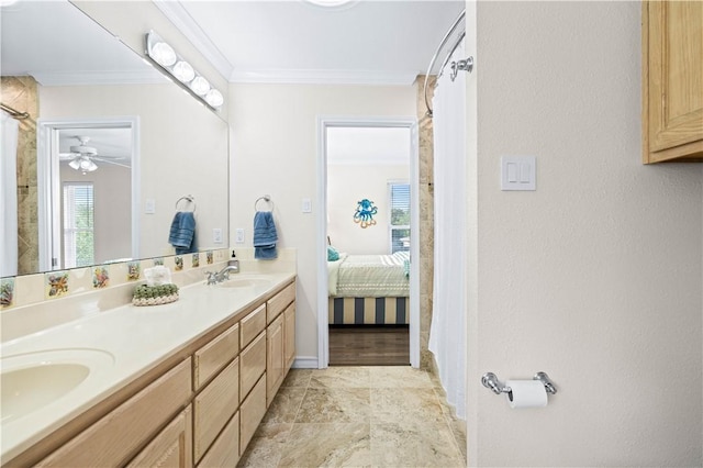 2110 Harbor Ct, Rockport, TX 78382 - ensuite bathroom featuring double vanity, ornamental molding, ceiling fan, baseboards, and curtained shower