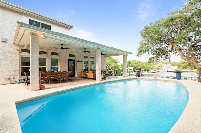 2110 Harbor Ct, Rockport, TX 78382 - swimming pool featuring ceiling fan, a patio area, and an outdoor hangout area