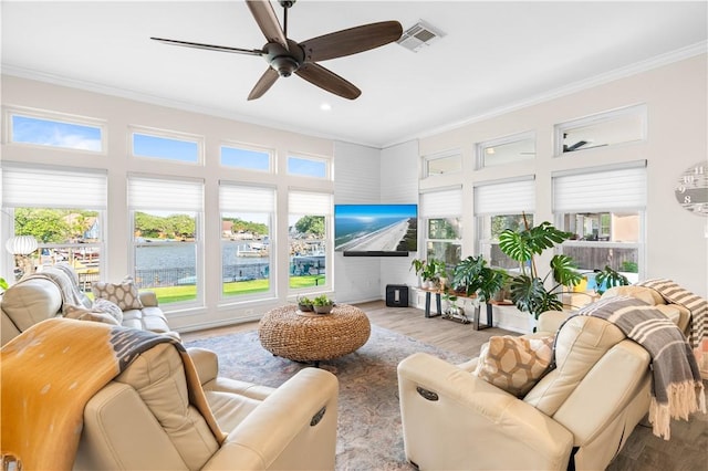 2110 Harbor Ct, Rockport, TX 78382 - living room featuring ornamental molding, wood finished floors, a ceiling fan, and recessed lighting