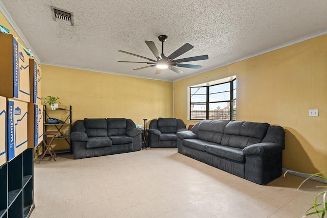504 S 9th St, Aransas Pass, TX 78336 - living room featuring a ceiling fan, crown molding, and a textured ceiling