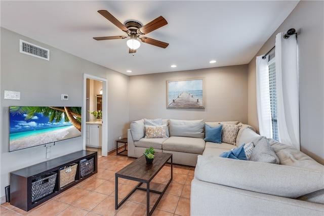 living room featuring ceiling fan and light tile patterned floors