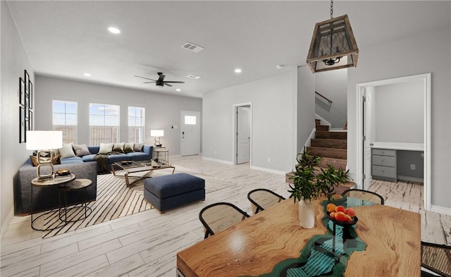 dining space featuring recessed lighting, visible vents, baseboards, stairs, and light wood-type flooring