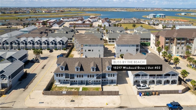 drone / aerial view featuring a water view and a residential view