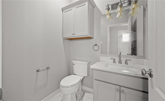 half bathroom with toilet, baseboards, and vanity