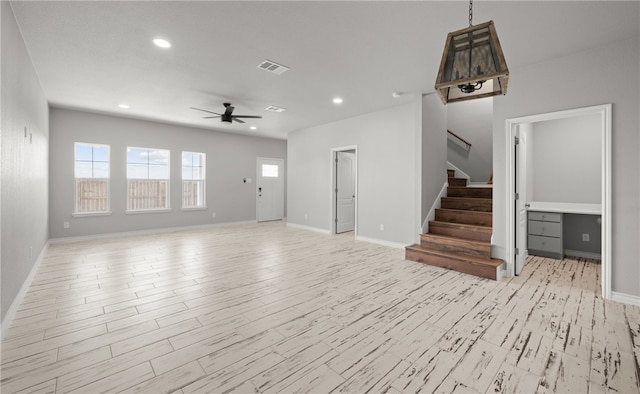 unfurnished living room with visible vents, ceiling fan, light wood-style flooring, stairs, and recessed lighting