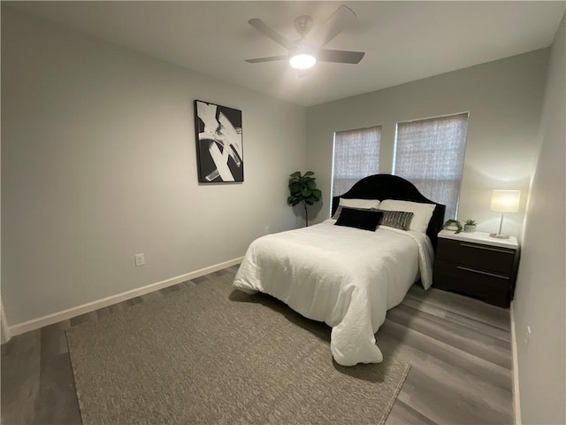 bedroom featuring a ceiling fan and baseboards