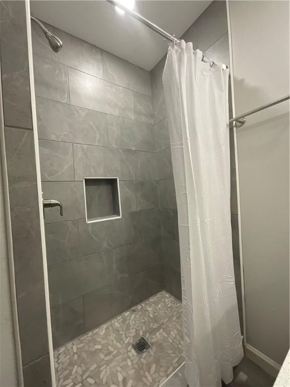 full bathroom with a stall shower