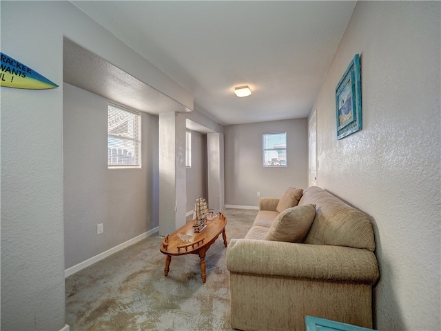 living area with carpet floors and a wealth of natural light