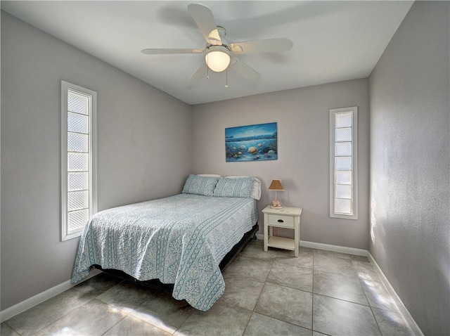 tiled bedroom with ceiling fan