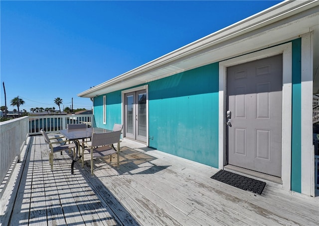 wooden deck featuring french doors