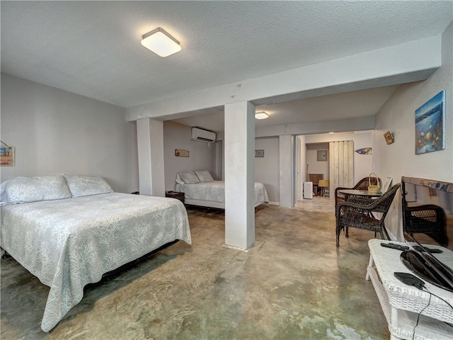 bedroom with concrete flooring, a textured ceiling, and a wall unit AC