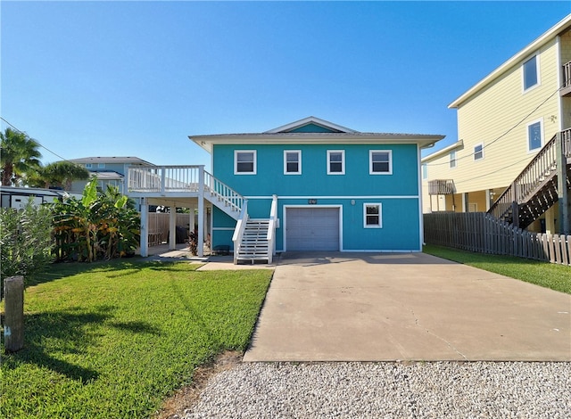 view of front of house with a garage and a front yard