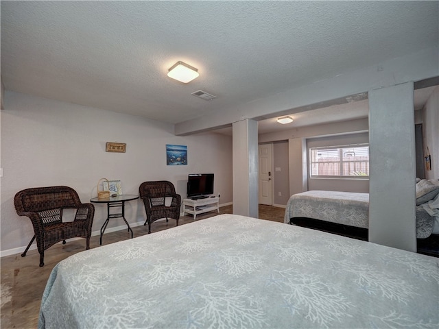 bedroom featuring a textured ceiling