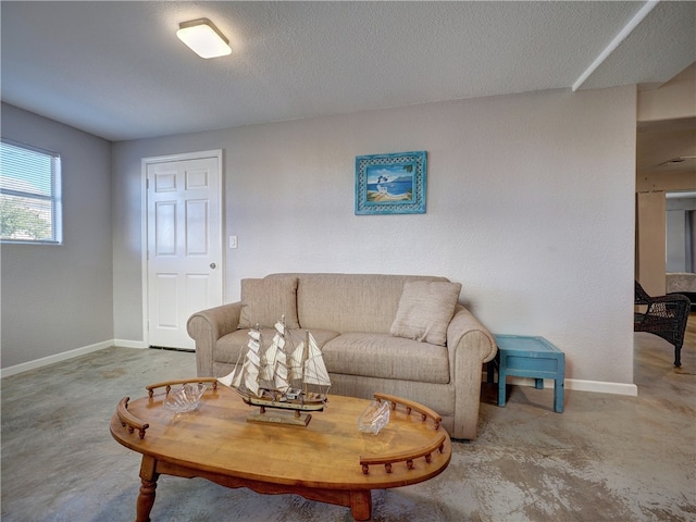 living room with a textured ceiling