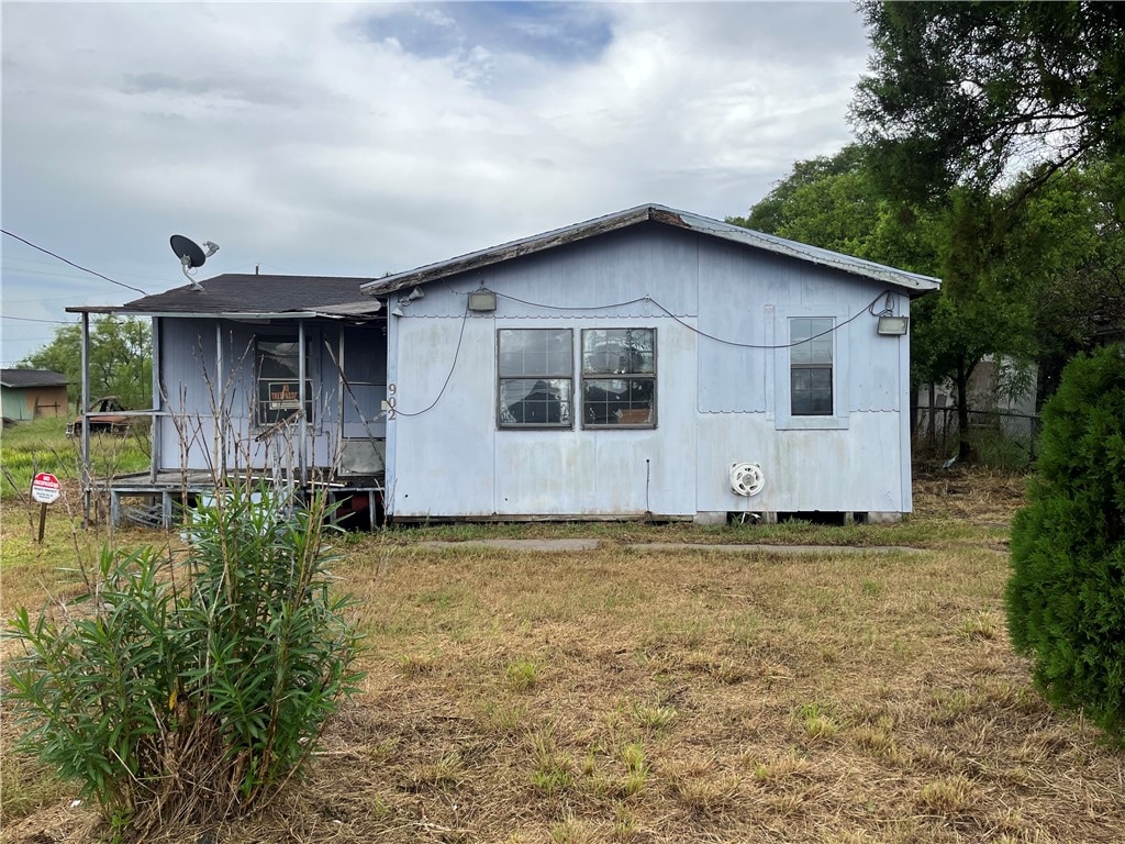 view of property exterior featuring a lawn