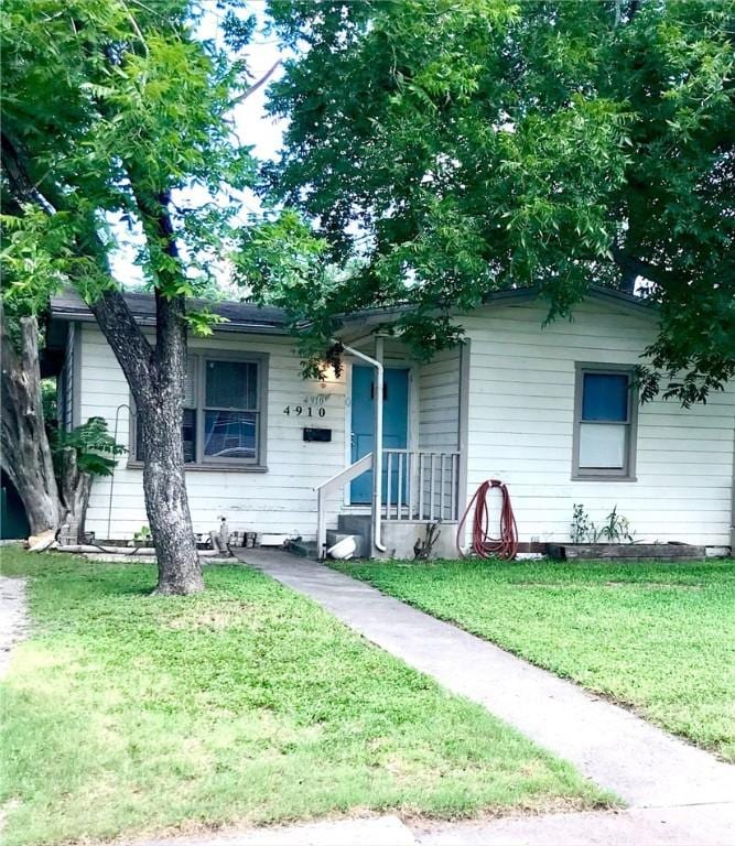 4910 Joann St, Corpus Christi, TX 78415 - view of front facade featuring a front lawn