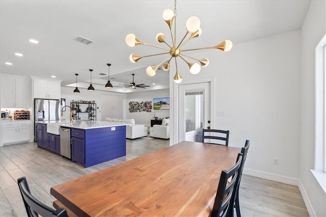 7910 Parham Dr, Corpus Christi, TX 78414 - dining room featuring light wood-style flooring, recessed lighting, a chandelier, and a ceiling fan