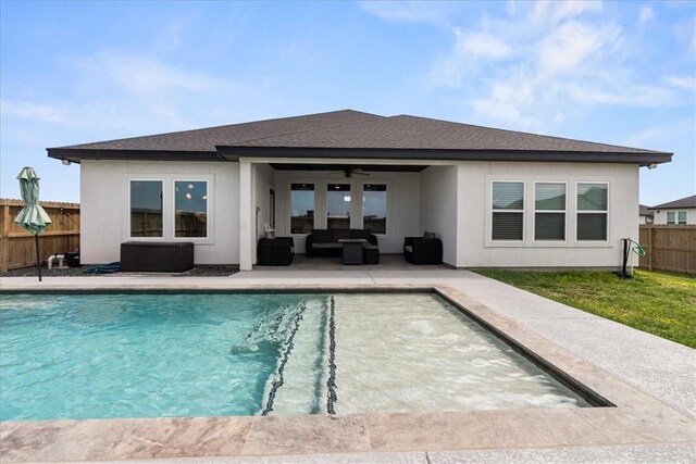 7910 Parham Dr, Corpus Christi, TX 78414 - back of house with outdoor lounge area, a fenced backyard, stucco siding, and ceiling fan