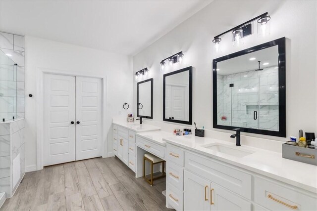 7910 Parham Dr, Corpus Christi, TX 78414 - full bath featuring a shower stall, double vanity, and wood finished floors