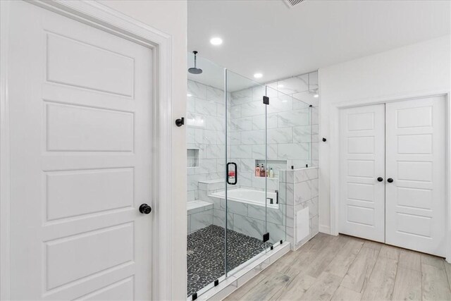 7910 Parham Dr, Corpus Christi, TX 78414 - full bathroom with a marble finish shower, wood finished floors, and recessed lighting