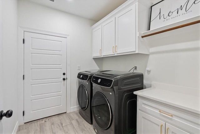 7910 Parham Dr, Corpus Christi, TX 78414 - laundry room with cabinet space, washer and clothes dryer, and light wood finished floors