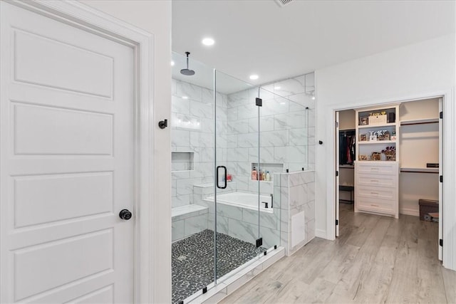 7910 Parham Dr, Corpus Christi, TX 78414 - full bath featuring a walk in closet, a marble finish shower, wood finished floors, and recessed lighting