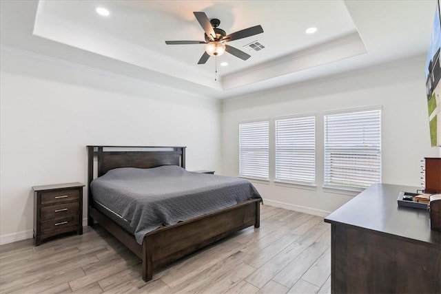 7910 Parham Dr, Corpus Christi, TX 78414 - bedroom with a tray ceiling, light wood finished floors, recessed lighting, a ceiling fan, and crown molding