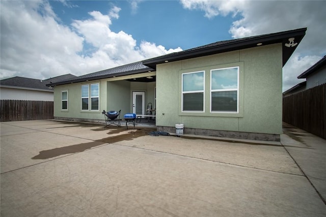6730 Effat Dr, Corpus Christi, TX 78414 - back of house with a patio, a fenced backyard, and stucco siding