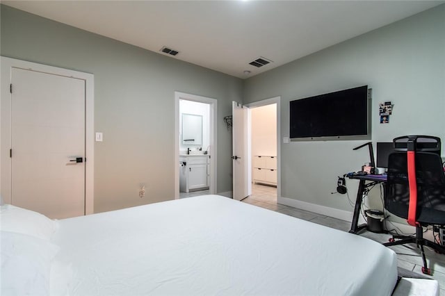 6730 Effat Dr, Corpus Christi, TX 78414 - bedroom featuring ensuite bath, light tile patterned flooring, and an office area
