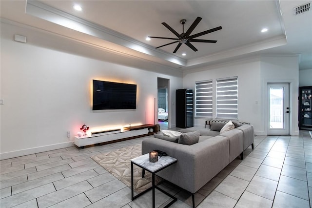 6730 Effat Dr, Corpus Christi, TX 78414 - living area with a tray ceiling, ceiling fan, ornamental molding, light tile patterned floors, and recessed lighting