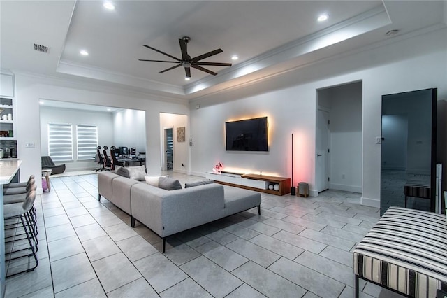 6730 Effat Dr, Corpus Christi, TX 78414 - living room featuring a tray ceiling, ceiling fan, ornamental molding, recessed lighting, and light tile patterned floors