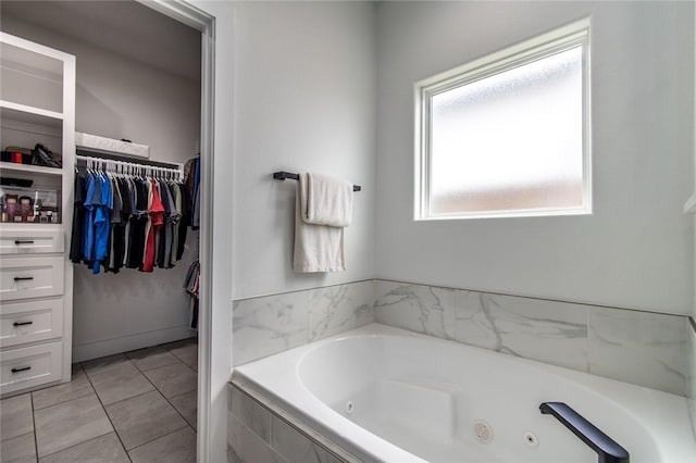 6730 Effat Dr, Corpus Christi, TX 78414 - bathroom featuring a whirlpool tub, tile patterned floors, and a spacious closet