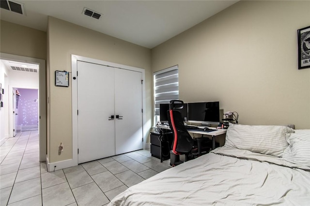 6730 Effat Dr, Corpus Christi, TX 78414 - bedroom featuring light tile patterned floors, a closet, and a desk