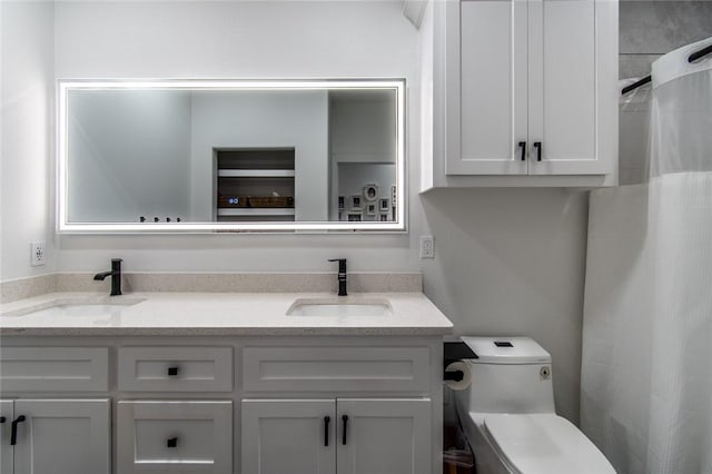 6730 Effat Dr, Corpus Christi, TX 78414 - bathroom with double vanity and toilet