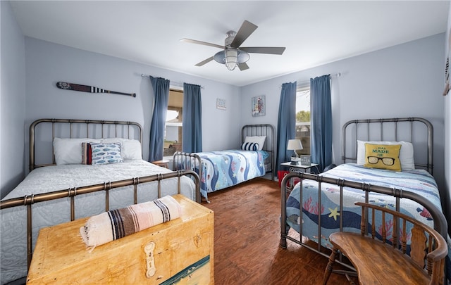 bedroom featuring ceiling fan and dark hardwood / wood-style flooring