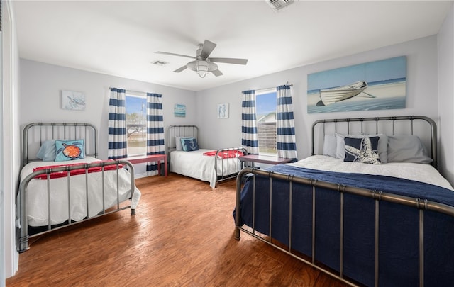 bedroom featuring ceiling fan and wood-type flooring