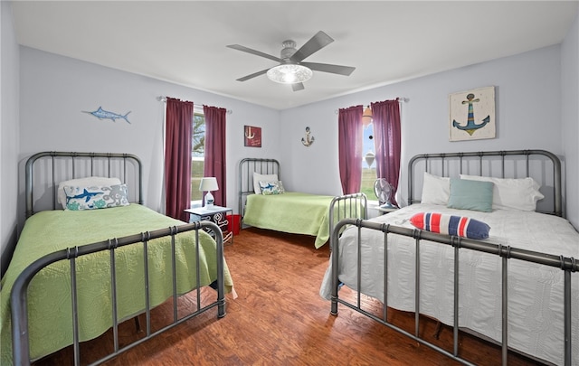 bedroom featuring ceiling fan and hardwood / wood-style flooring