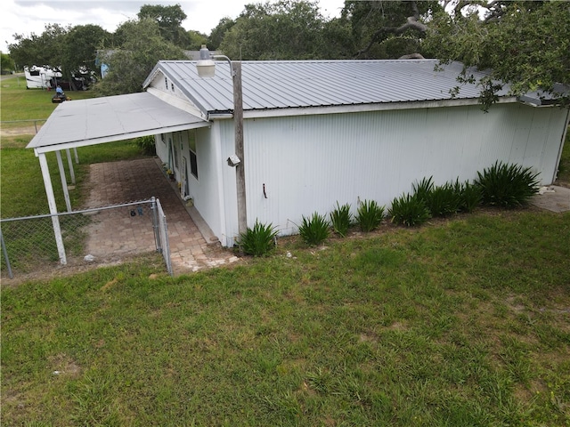 view of property exterior with a yard