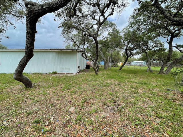 view of yard with an outdoor structure