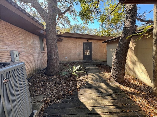 entrance to property featuring cooling unit